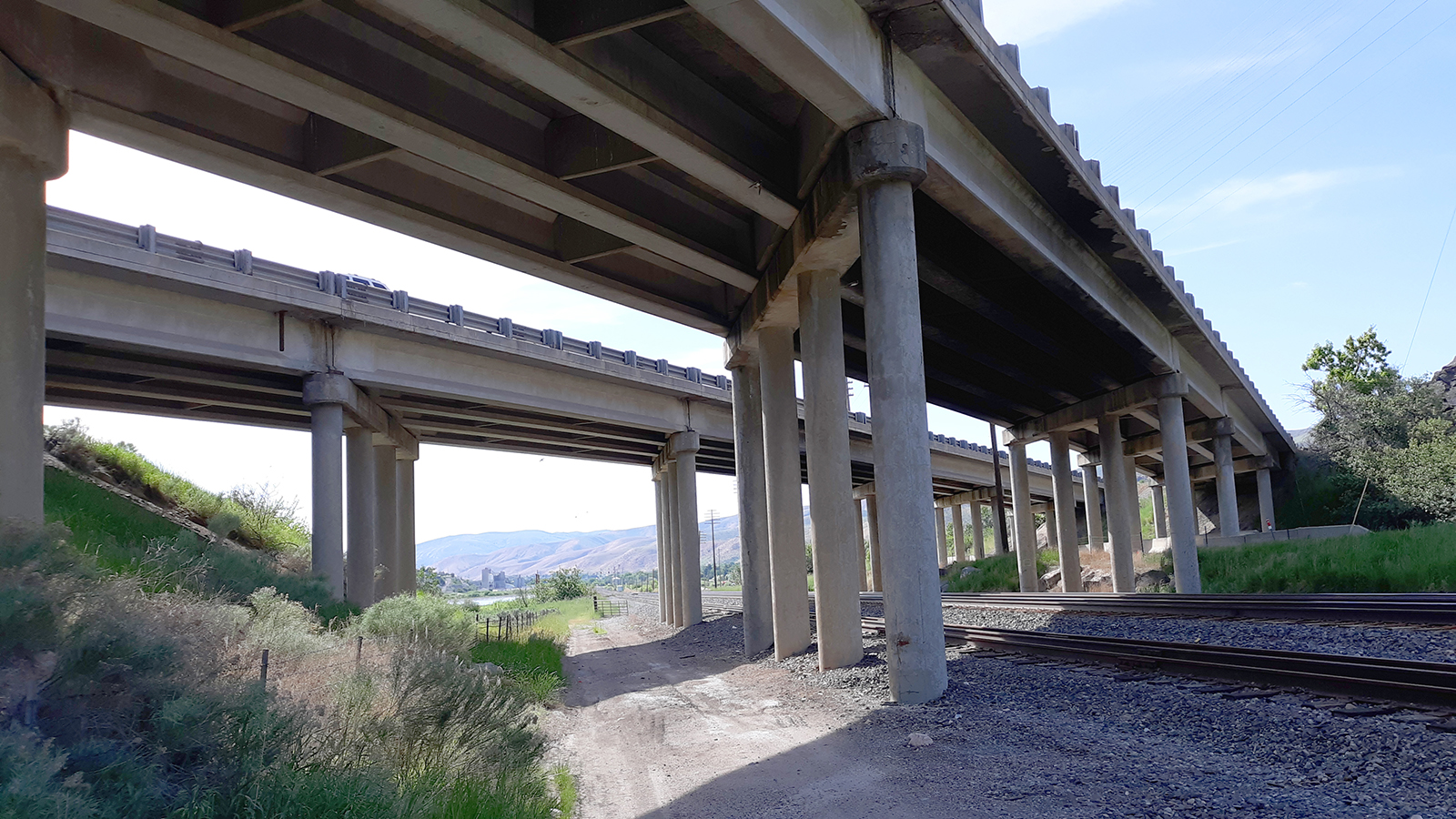 View underneath aging bridge over Union Pacific Railroad tracks.
