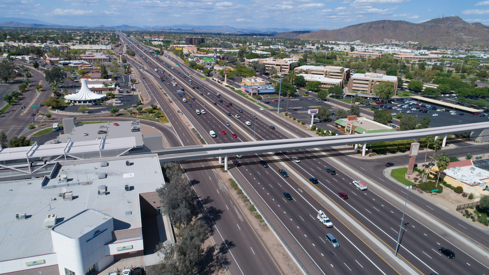 The photo simulation shows the future I-17 light rail bridge (looking northeast) crossing I-17 at the Mountain View Rd. alignment.