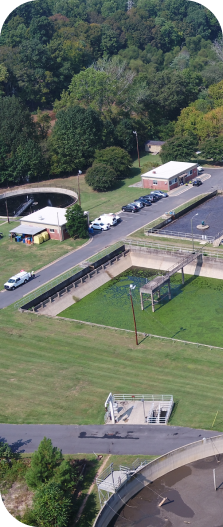 An arial view of the Belmont Pump Station showing the pools for grit and sludge removal, and the aeration and biological reduction tank.